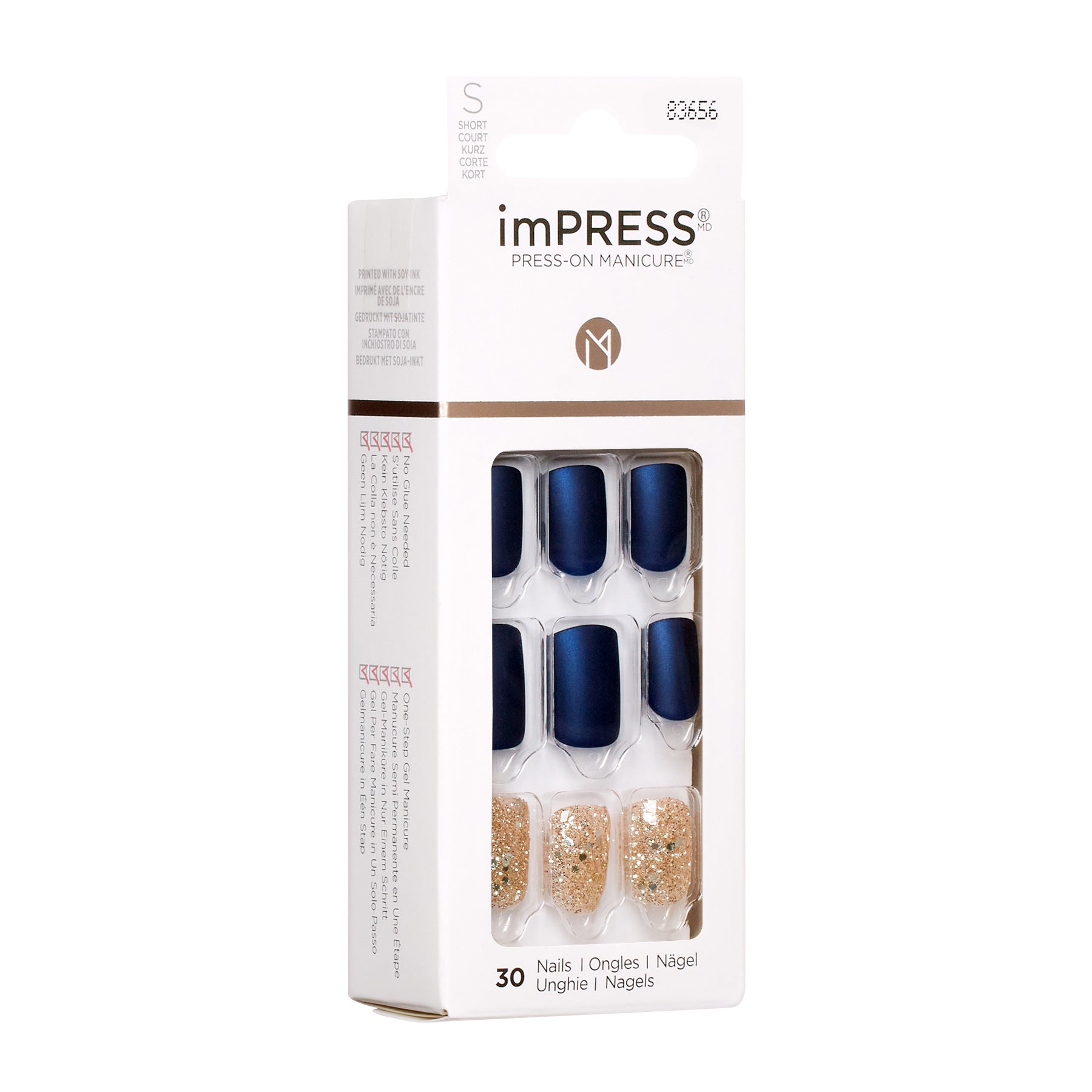 KIM005C_extra_003 "A package of imPRESS Press-On Manicure nails. The packaging is primarily white with a transparent window in the center, allowing the nails inside to be visible. The package contains 30 press-on nails in two different designs. The top row of nails is a solid dark blue color, while the bottom row features a glittery gold design."