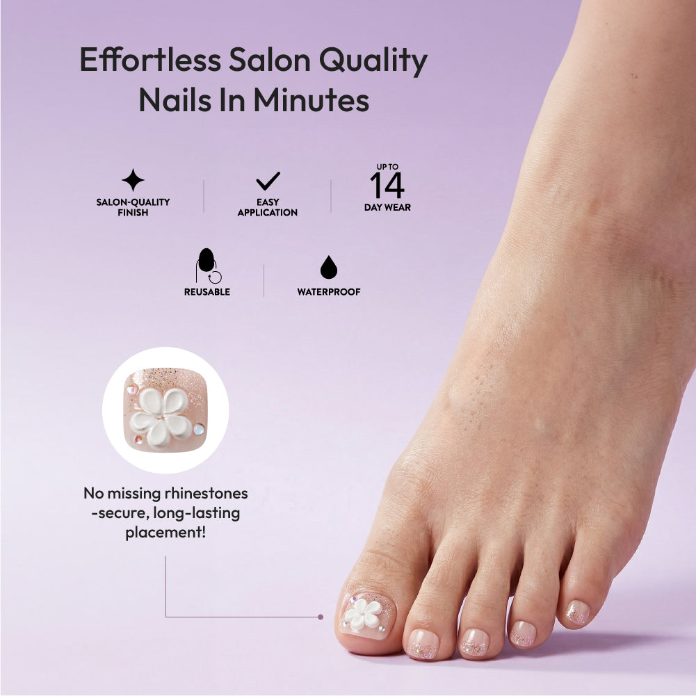 Gold Finger Glitzy 3D Press-On Toenails in Sterling – Squoval Fake Toes, Clear Glitter with 3D White Flower, Luxury Glue On Pedicure, Wider Fit 24 Pc Kit